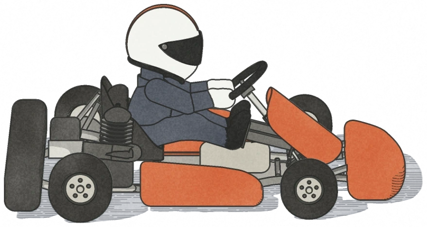 The test driver in a white helmet, in an orange kart.